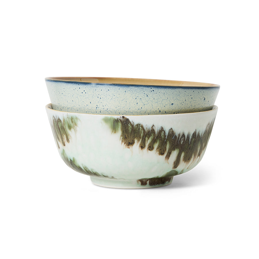 Two ceramic bowls with textured surfaces on a white background