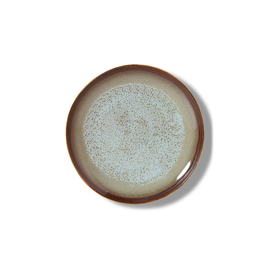 Ceramic plate with speckled design on a white background