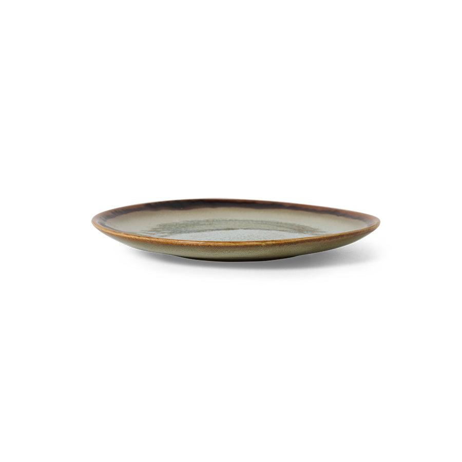 Ceramic plate with a brown rim on a white background