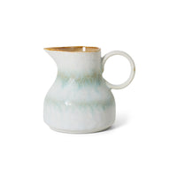 small jar off white and soft blue on white background