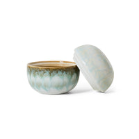 Ceramic bowl with a matching lid on a white background