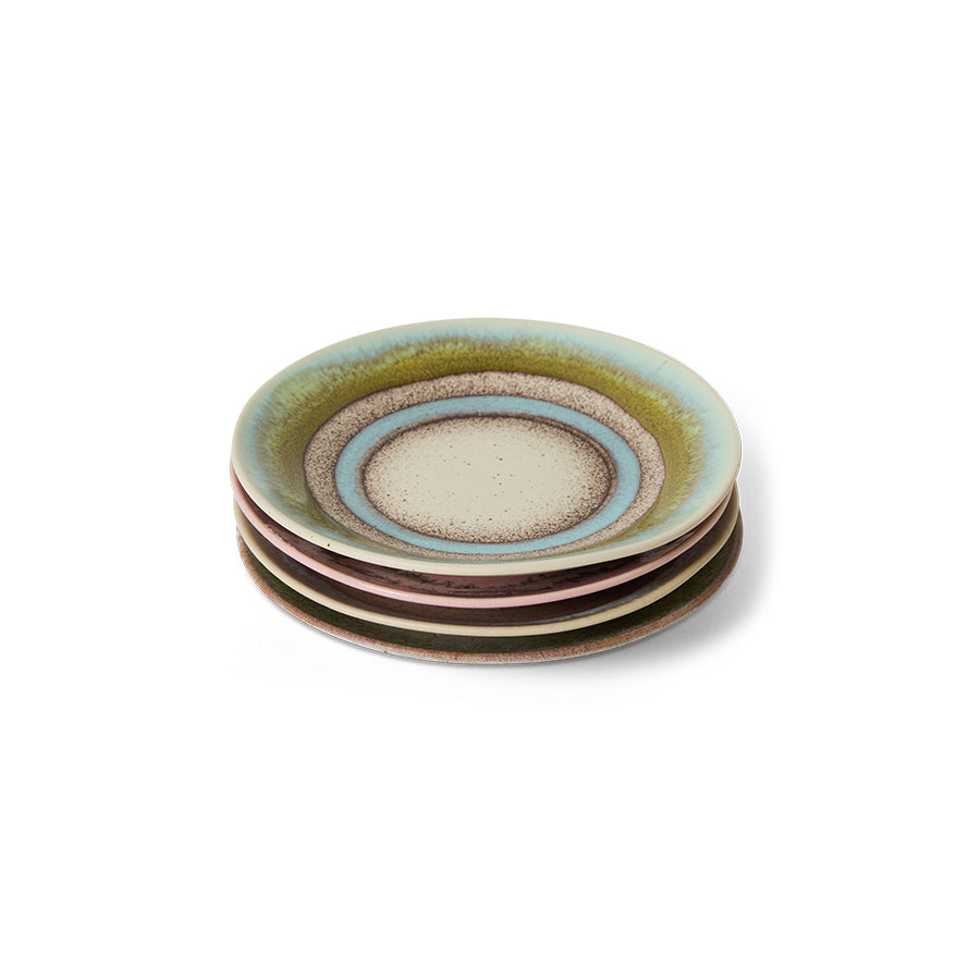Set of four ceramic plates with multicolored glaze on a white background