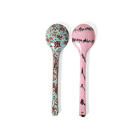 Two decorative spoons with floral patterns on a white background