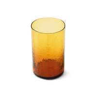 Amber glass tumbler on a white background