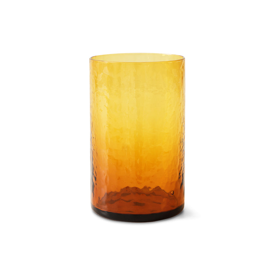 Amber glass tumbler on a white background