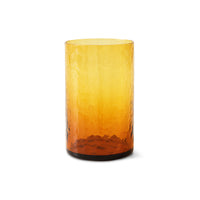 Amber glass tumbler on a white background