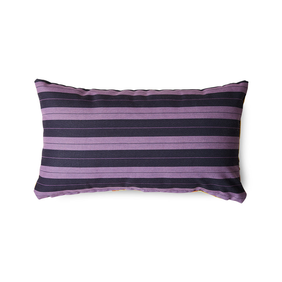 Purple and black striped pillow on a white background