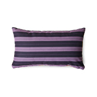 Purple and black striped pillow on a white background