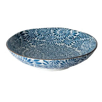 Blue and white patterned ceramic bowl on a white background
