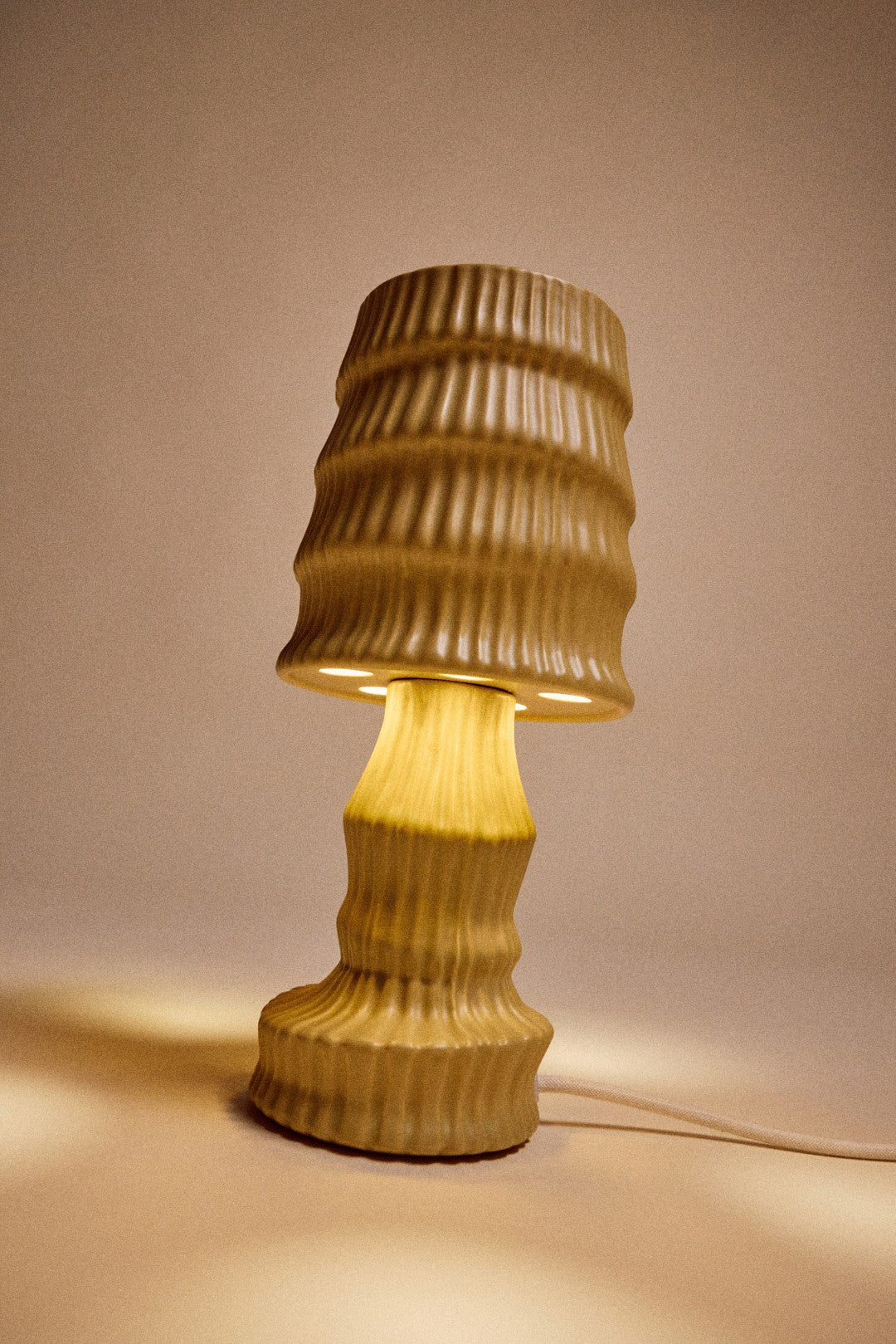 Woven rattan table lamp on a neutral background