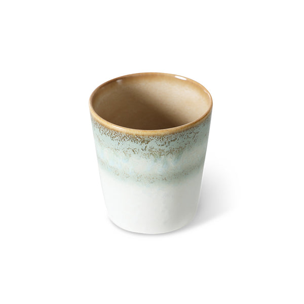 pastel colored ceramic tumbler cup on white background