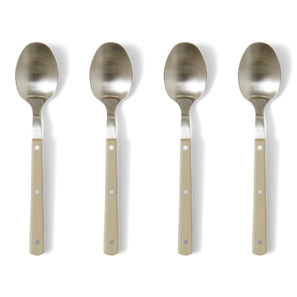 Set of four metal spoons with beige handles on a white background
