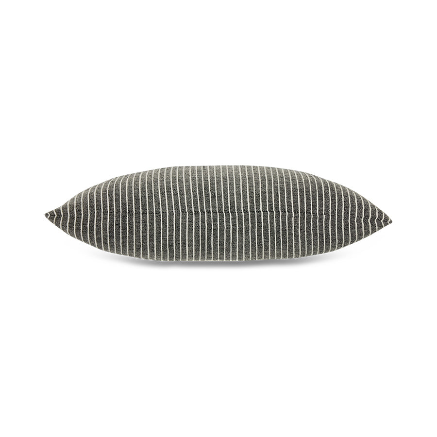 Textured black and white cushion on a white background