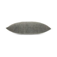 Textured black and white cushion on a white background