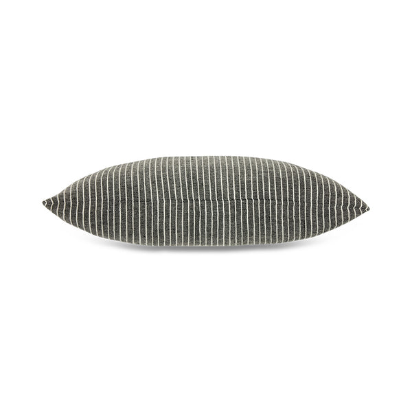 Textured black and white cushion on a white background