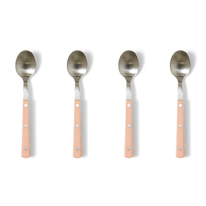 Four spoons with pink handles on a white background