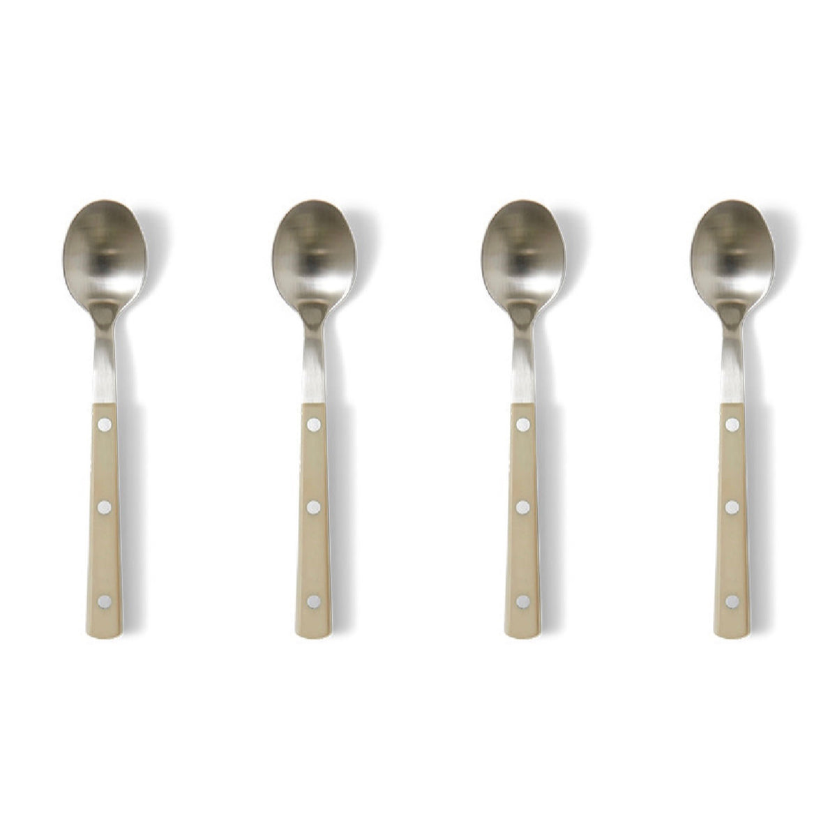 Four silver spoons with beige handles on a white background