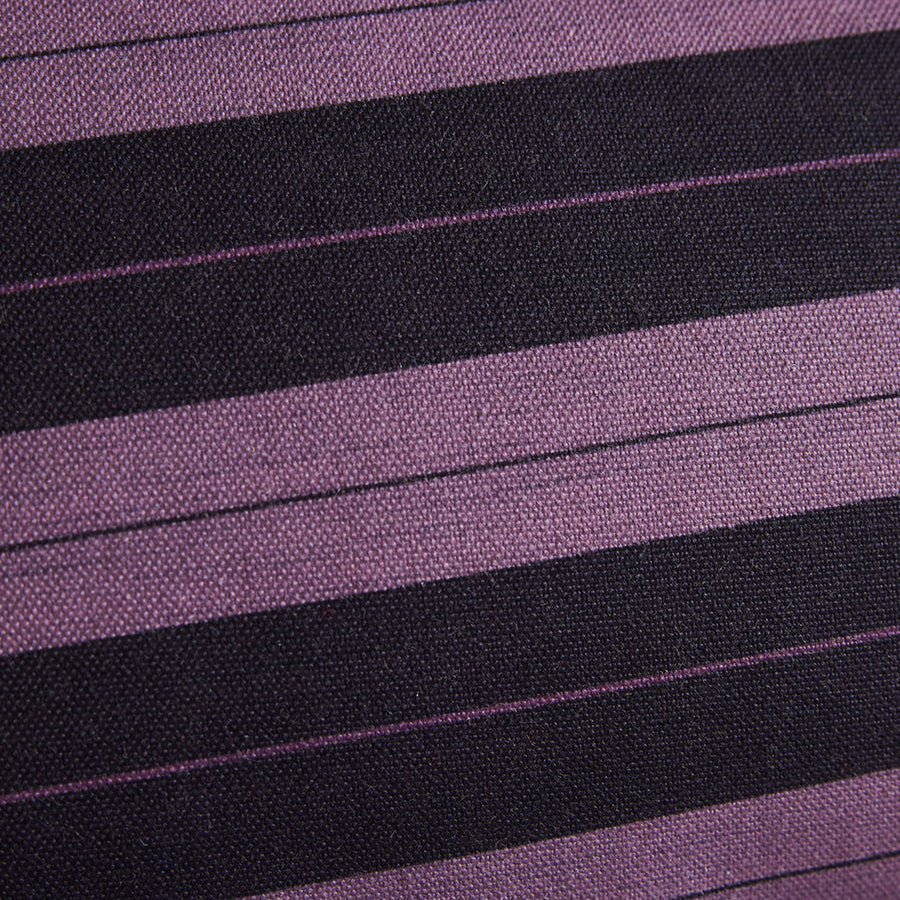 Close-up of purple and black striped fabric texture