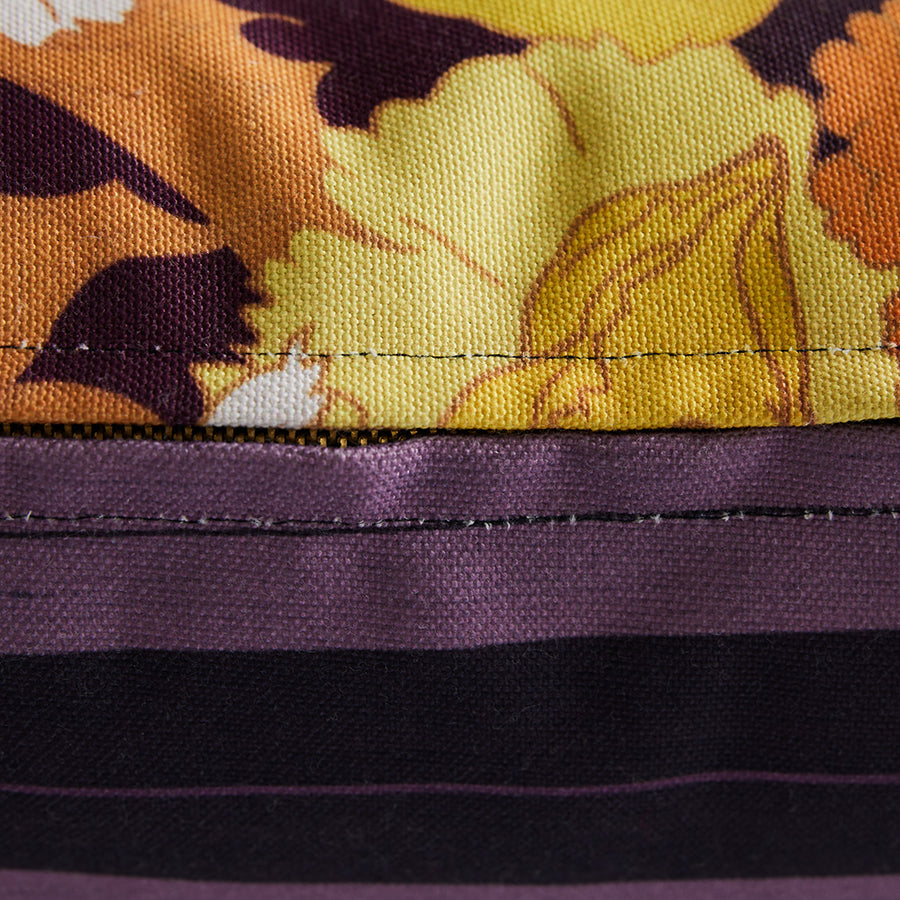 Close-up of a fabric with floral pattern and purple border
