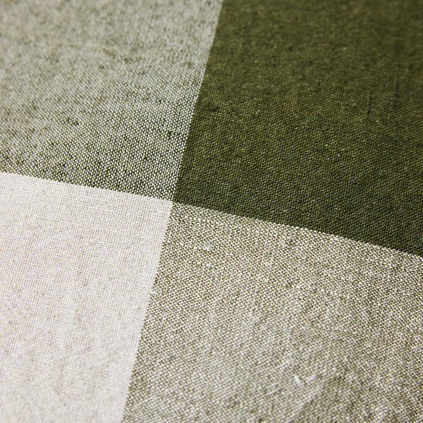 Close-up of fabric with green, gray, and white checkered pattern