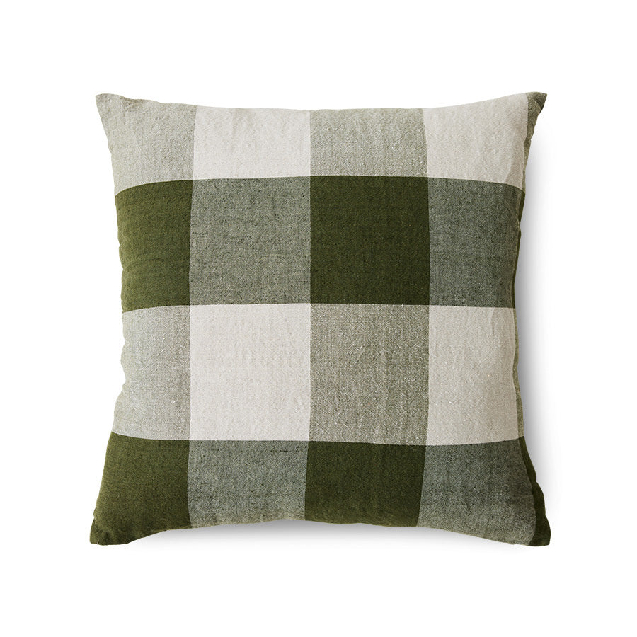 Green and beige checkered pillow on a white background
