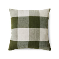 Green and beige checkered pillow on a white background