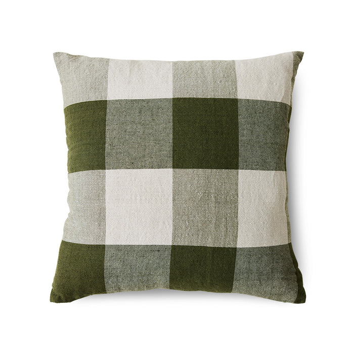 Green and beige checkered pillow on a white background