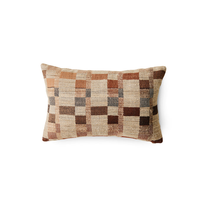 Checkered patterned pillow on a white background