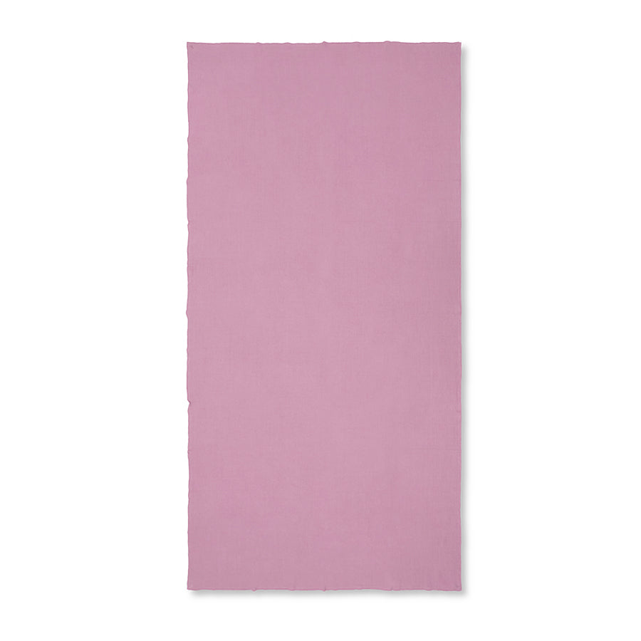 Solid pink tablecloth on a white background