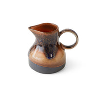 retro style creamer in brown tones with reactive glaze finish and texture