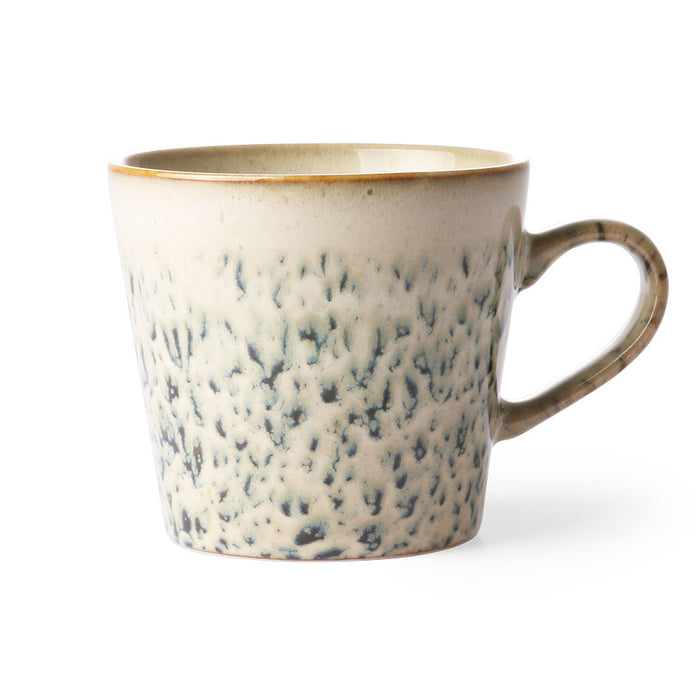 Speckled ceramic mug on a white background