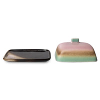 Black rectangular plate and colorful rectangular container on a white background