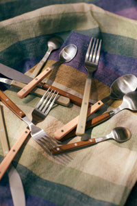 bistro style cutlery on a plaid cloth