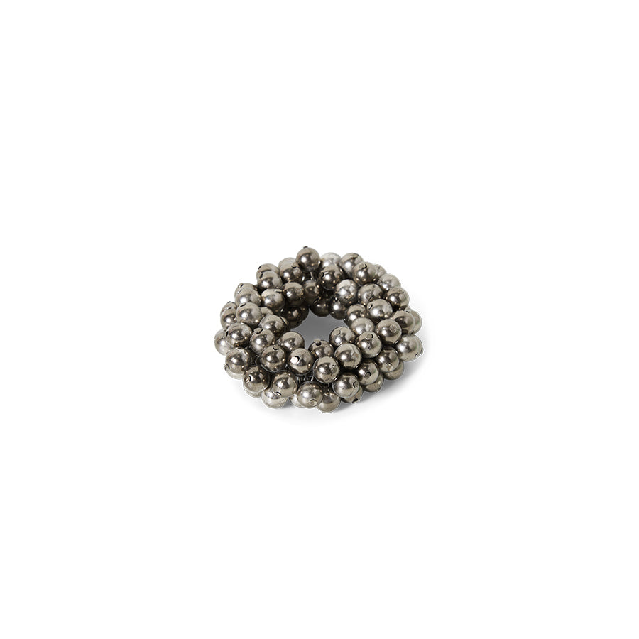 Silver beaded ring on a white background