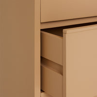 wooden chest of drawers in camel color