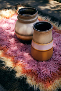brown yellow orange and pink fluffy rug