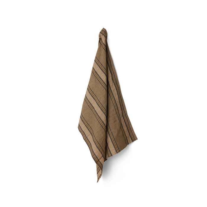 Brown striped towel hanging on a white background