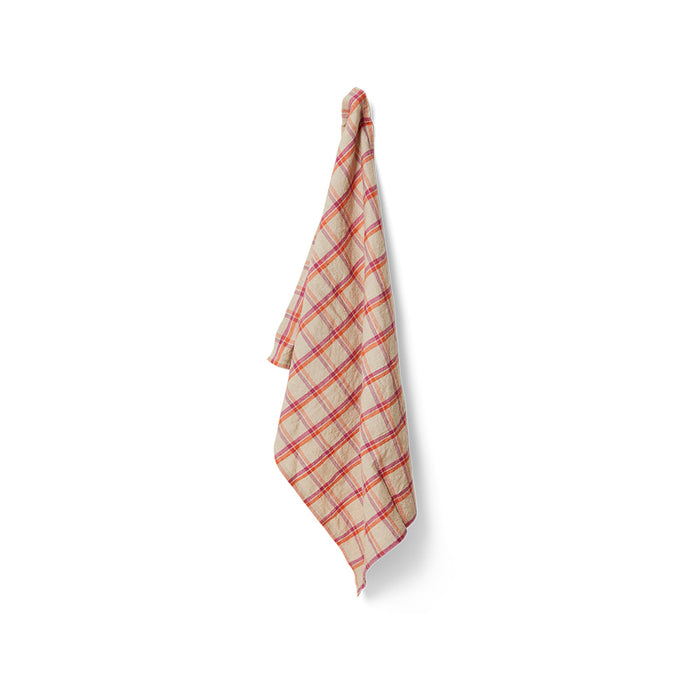 Plaid towel hanging on a white background