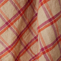 Close-up of fabric with red and purple plaid pattern