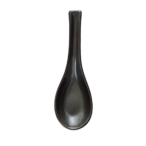 Black ceramic spoon on a white background