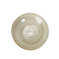 Ceramic plate with a textured surface on a white background