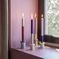 bold color blocking set of 4 candle stick holders with burning candles