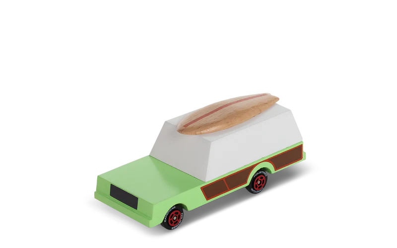 Toy van with a surfboard on top on a white background