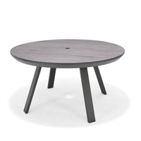Round wooden table with four legs on a white background