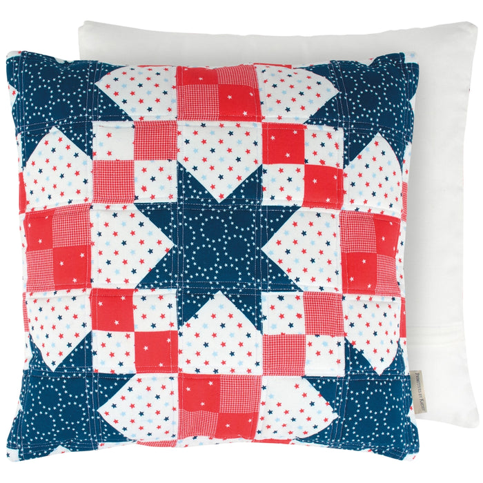 Patchwork pillow with star pattern in red, white, and blue on a white background