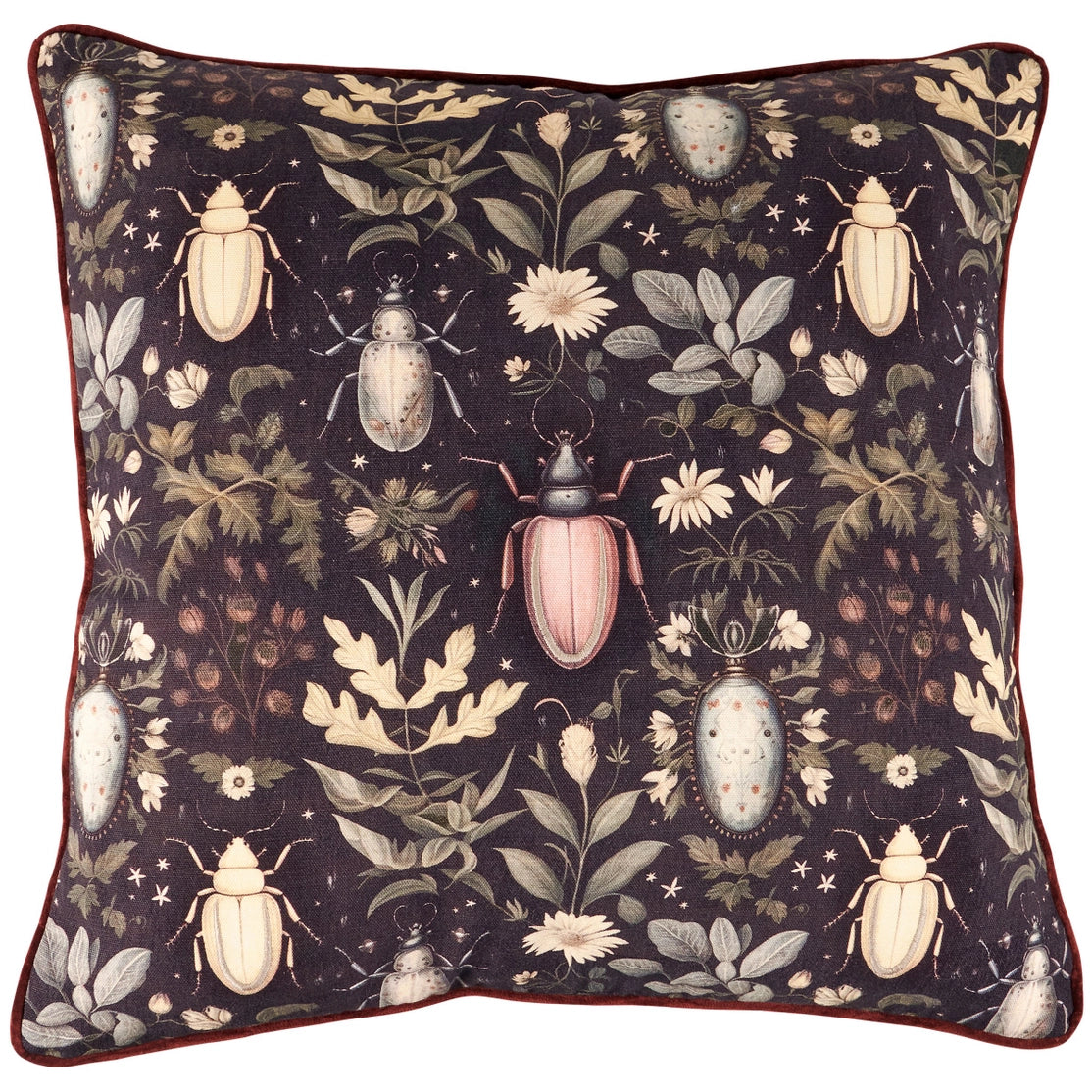 Decorative pillow with beetle and floral pattern on a dark background