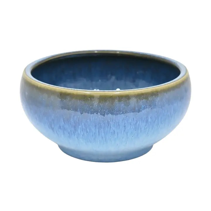 Blue ceramic bowl on a white background