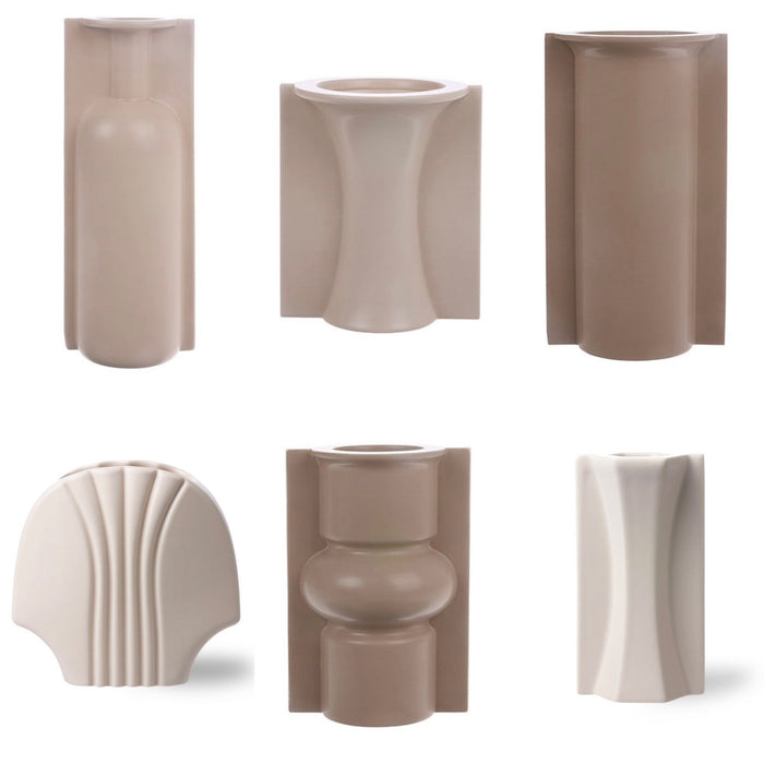 Set of various beige ceramic vases on a white background