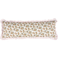 Floral patterned pillow with ruffled edges on a white background