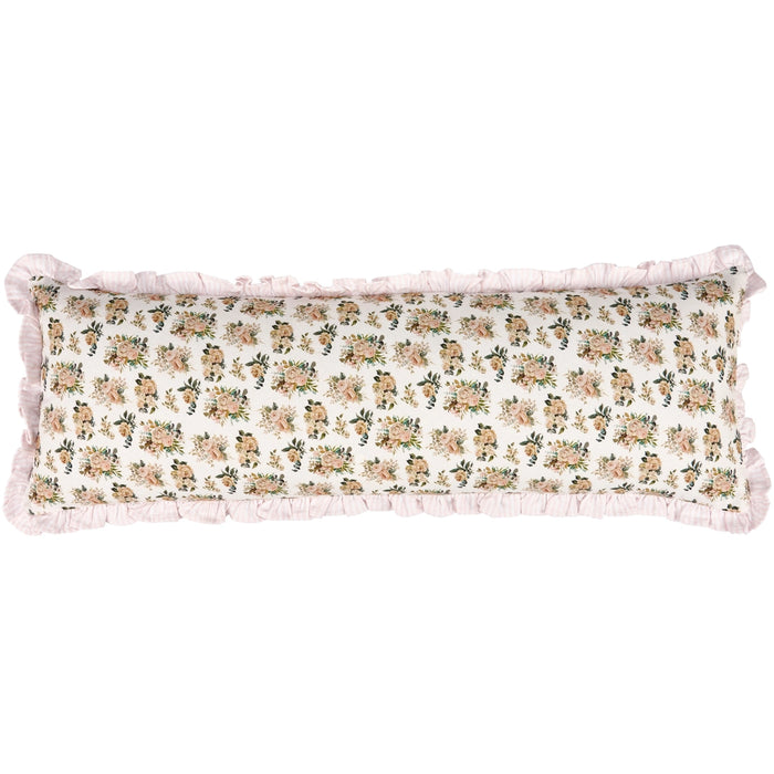 Floral patterned pillow with ruffled edges on a white background